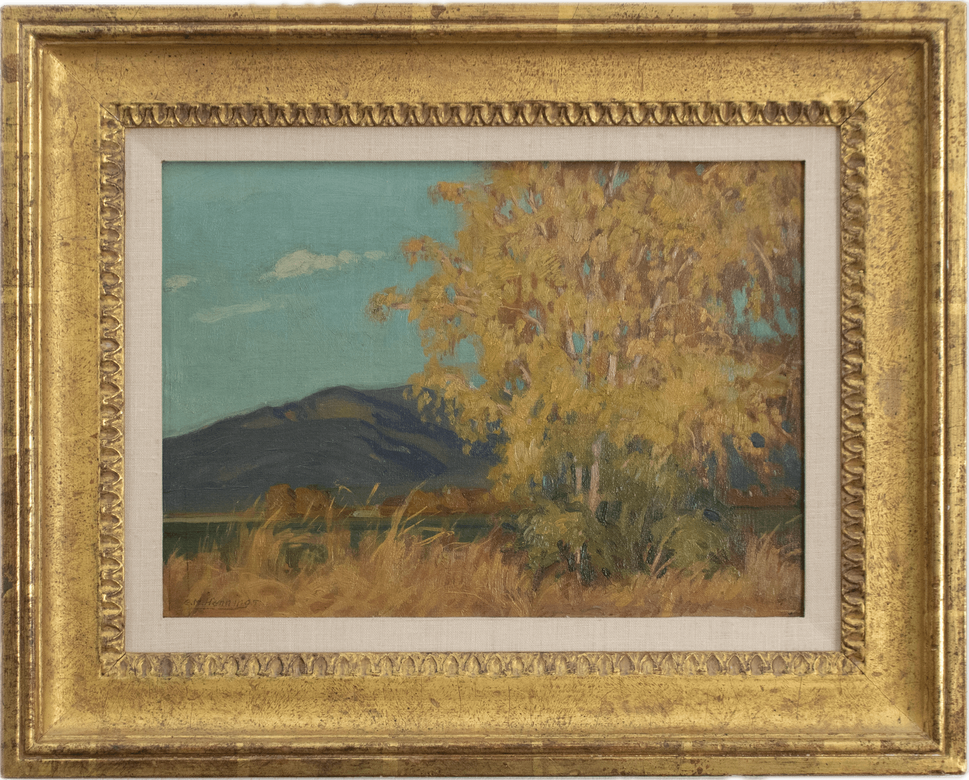 A New Mexico landscape featuring golden cottonwood trees in autumn foliage against deep blue mountains under a turquoise sky with white clouds, exemplifying the luminous plein air style of the Taos Society of Artists.