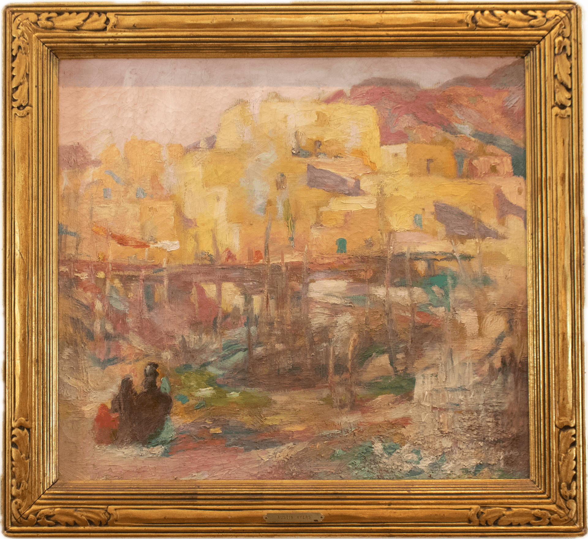 Adobe pueblo buildings in warm golden and ochre tones rising against purple mountains, with Native American figures in the foreground, painted in loose Impressionist brushwork capturing the luminous atmosphere of the American Southwest.