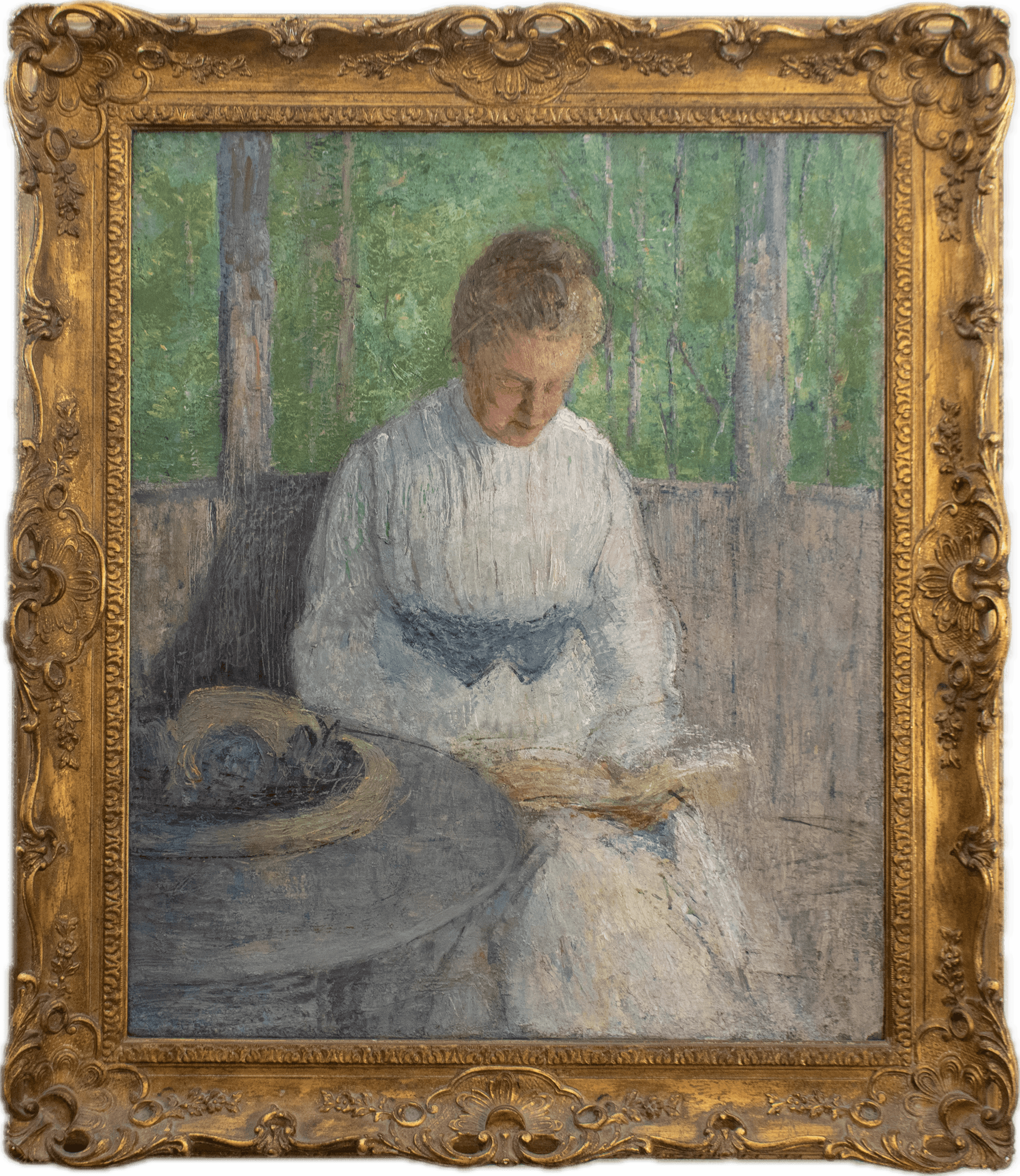 A woman in an elegant white dress seated at a table reading, her straw hat beside her, with green trees visible through windows behind, painted in soft Impressionist tones of white, gray, and green with delicate brushwork.